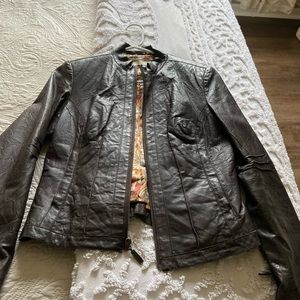 Wilson’s brown leather jacket